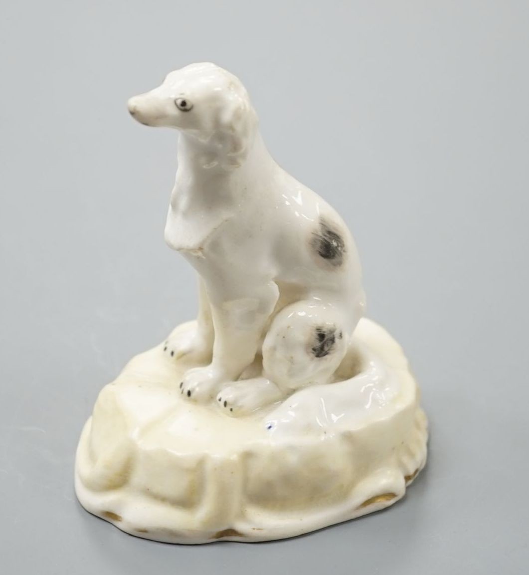 A rare Samuel Alcock porcelain model of a saluki or Persian greyhound, impressed mark 252, 8.3 cm high, Cf. Dennis G.Rice Dogs in English porcelain, colour plate 214 illustrating an identical example with incorrect facto